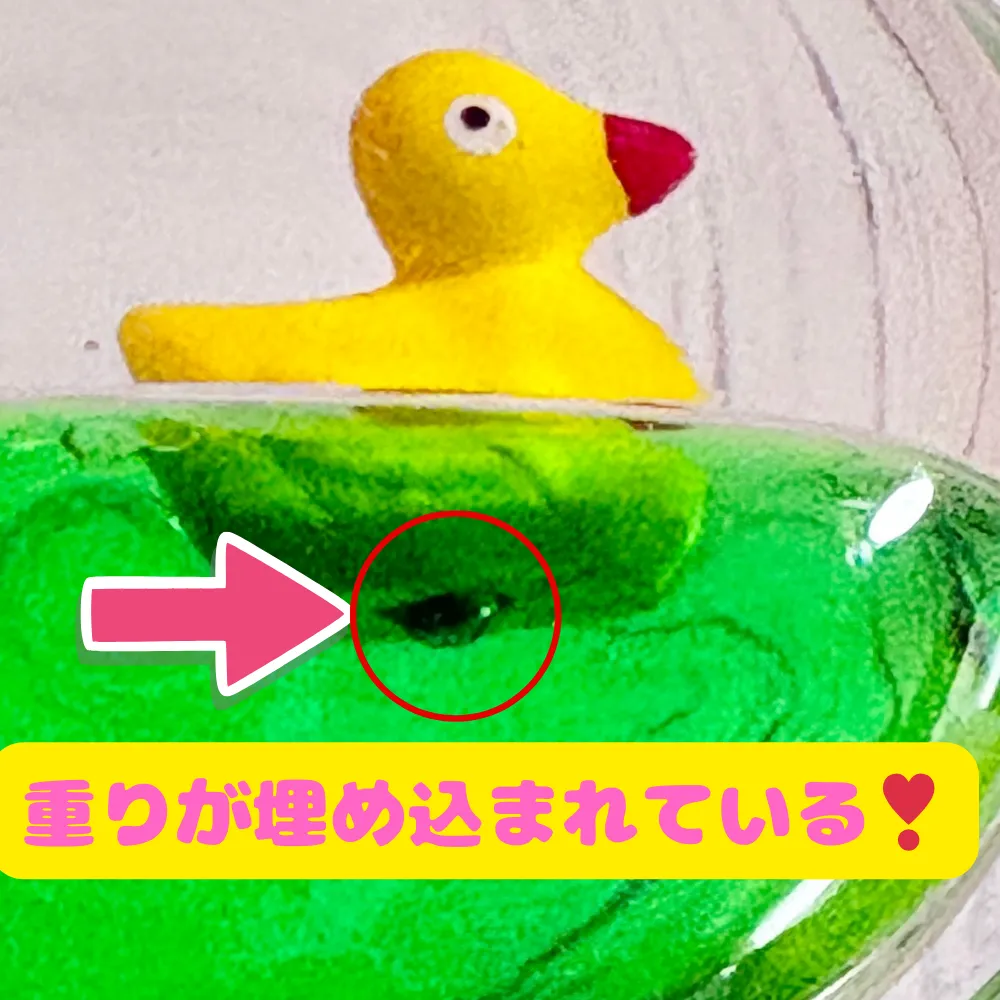 オイルタイマーの人形に重りが埋め込まれている画像